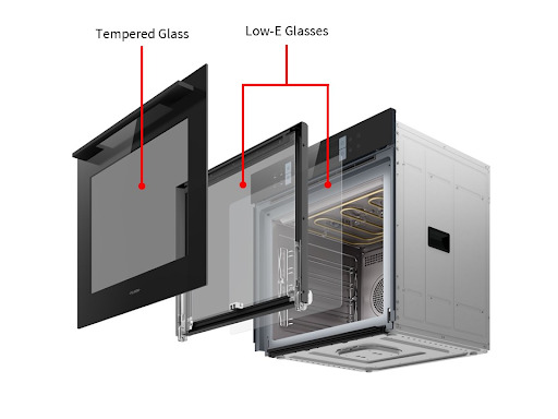 Exploded view diagram of a built-in oven door, illustrating its three-layer heat insulation construction with one outer layer labeled "Tempered Glass" and two inner layers labeled "Low-E Glasses".