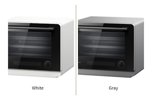 Two modern countertop ovens displayed side-by-side, showcasing the available white and gray exterior color options.