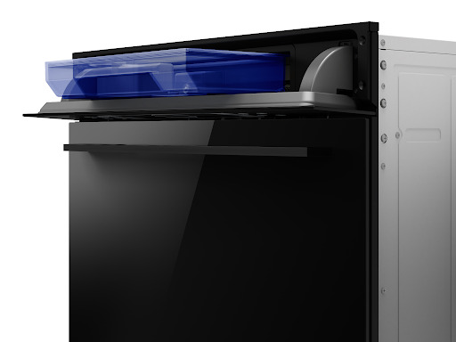 Close-up of a modern built-in steam oven showing the blue water reservoir slightly pulled out from the control panel area above the door.