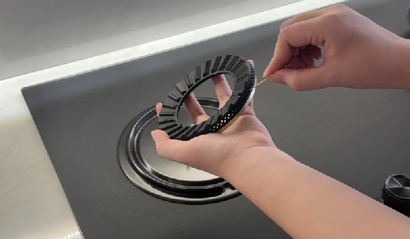 Cleaning a gas hob burner ring to remove dirt and improve ignition performance
